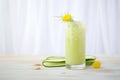 cucumber juice in highball glass, cucumber ribbon