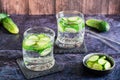 Cucumber mineral water in glasses on the table. Homemade antioxidant drinks