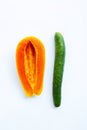 Cucumber and papaya on white background. Sex concept