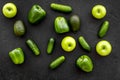 Cucumber, pepper, apple, celeriac. Vegetables for greeny organic smoothy for sport diet on dark background top view Royalty Free Stock Photo