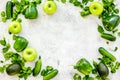 Cucumber, pepper, apple, celeriac. Vegetables for greeny organic smoothy for sport diet on stone background top view Royalty Free Stock Photo