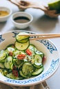 Cucumber salad in Chinese chopsticks