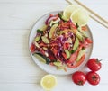 Cucumber salad tomatoes health vegan appetizer lemon wand on a wooden background Royalty Free Stock Photo