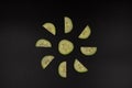 Cucumber slices and halves arranged in the shape of the sun Royalty Free Stock Photo