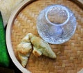  Cucumber and hot croissants in a wicker tray 