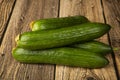 Cucumbers are green on a wooden background.Fresh vegetables. Sale