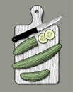 Cucumbers with a knife on the wood cutting board Royalty Free Stock Photo