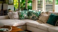 Cuddle up on the comfortable oversized couch dd in plush leafpatterned cushions and throws. The room is scented with a