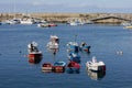Horizontal view of local fishing boats in the harbour. Royalty Free Stock Photo