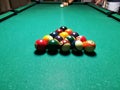 Cue aim billiard snooker pyramid on green table. A Set of snookers/pool balls on Billiards table. Royalty Free Stock Photo