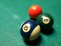 Cue aim billiard snooker pyramid on green table. A Set of snookers/pool balls on Billiards table.