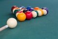 Cue aiming white ball to break snooker billards on table Royalty Free Stock Photo