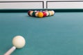 Cue aiming white ball to break snooker billards on table Royalty Free Stock Photo