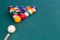 Cue aiming white ball to break snooker billards on table Royalty Free Stock Photo