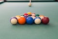 Cue aiming white ball to break snooker billards on table Royalty Free Stock Photo