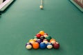 Cue aiming white ball to break snooker billards on table Royalty Free Stock Photo