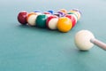 Cue aiming white ball to break snooker billards on table Royalty Free Stock Photo