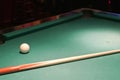 Cue ball and stick on pool table Royalty Free Stock Photo