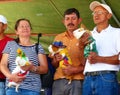 Participants of the international cuy food festival with Guinea pigs, Ecuador Royalty Free Stock Photo