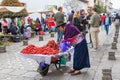 Quechua woman selling strawberries and rambutan, Ecuador