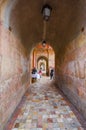 Cuenca, Ecuador - April 22, 2015: Walking tunnel paths and marketplaces located alongisde facade of main cathedral, very