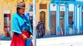 Woman Indigenous quechua of Ecuador selling lemons at plaza, Ecuador