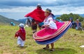 Ecuadorian folk dancers dressed as Cayambe people performance outdoors traditional dance for tourists