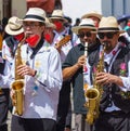 cuenca, Ecuador, Dec 24, 2021 - Men play saxiphone in the traditional Traveling Child Pase del Nino Christmas Eve Parade Royalty Free Stock Photo