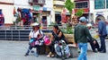 Two unidentified women venders sell panama hats, Ecuador