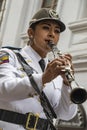 Cuenca, Ecuador - December 24, 2015 - Woman wears Ecuadorian Army uniform and plays the clarinet Royalty Free Stock Photo