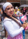 A beautiful woman folk dancer smiles at the audience. Ecuador