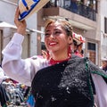 A beautiful woman folk dancer on Carnival parade in Cuenca. Ecuador