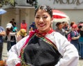 A beautiful woman folk dancer in embroidered typical clothing, Ecuador