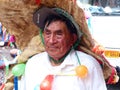 Senior man in huge hat as mythical character of Taita Carnival