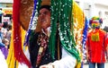 Senior man in huge hat as mythical character of Taita Carnival