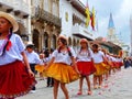 Cuenca, Ecuador. Group of girls dancers dressed in colorful costumes as cuencanas at the parade