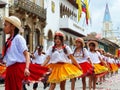 Cuenca, Ecuador. Group of girls dancers dressed in colorful costumes as cuencanas at the parade