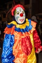 A man as clown at a traditional masquerade parade in Cuenca, Ecuador