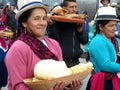 Village woman carries bowl with homemade cheese