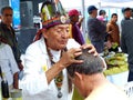 Indigenous healer performing health ceremony, Ecuador