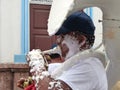 Musician with foam all over his face. Traditional Carnival in Ecuador