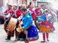Cuenca, Ecuador. Parade during Carnival. People and dancers spraying foam