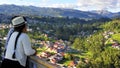 Woman cuencana looking at city Cuenca, Ecuador. Park of Light or Megaparque de la Luz.