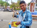 Young man sells churros, Ecuador