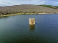 Cuerda del Pozo reservoir the bell tower of the church of La Muedra Soria province