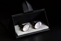 Cuff links on the black box Royalty Free Stock Photo