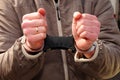 Cuffed and held. A suspect under arrest Royalty Free Stock Photo