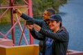 CUICOCHA, ECUADOR, NOVEMBER 06, 2018: Unidentified tourists taking selfies in front of the Cuicocha lake in the Province