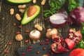 Cuisine, background of vegan food, avocado, pomegranate, green beans mushrooms, broccoli mushrooms, onions, nuts, greens. Clean Royalty Free Stock Photo