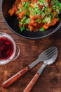 The cuisine of Portugal. Alentejo style pork with a glass of sweet porto wine Royalty Free Stock Photo